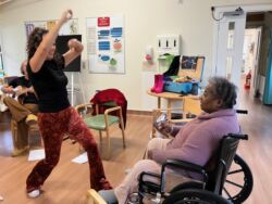 someone dancing and someone in a wheel chair